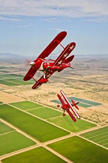 Two Pitts Special S-2A aerobatic biplanes in flight near Chandler, Arizona Two Pitts Special S-2A aerobatic biplanes in flight near Chandler, Arizona
