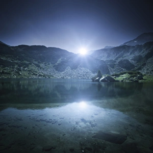 Ribno Banderishko Lake with setting Sun, Pirin National Park, Bulgaria Ribno Banderishko Lake with setting Sun, Pirin National Park, Bulgaria