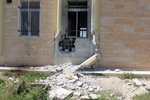 A Rocket Propelled Grenade damaged this portion of the wall A Rocket Propelled Grenade damaged this portion of the wall