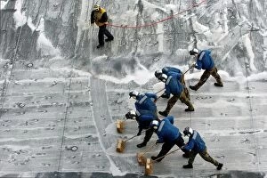 Images Dated 14th December 2005: Sailors conduct a Scrub Exercise on the flight deck aboard USS Peleliu