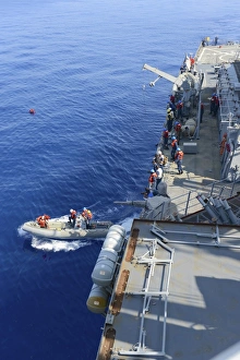 Sailors execute rescue operations in a rigid-hull inflatable boat Sailors execute rescue operations in a rigid-hull inflatable boat