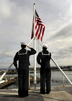 Sailors raise the national ensign aboard USS Abraham Lincoln Sailors raise the national ensign aboard USS Abraham Lincoln