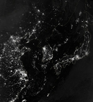 Satellite view of the Korean Peninsula showing city lights at night Satellite view of the Korean Peninsula showing city lights at night