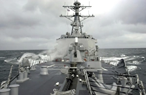 Sea spray whips across the deck of the USS Winston S. Churchill Sea spray whips across the deck of the USS Winston S. Churchill