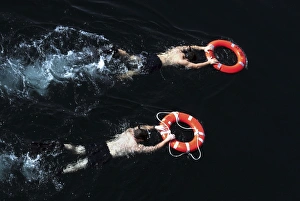 Search and rescue swimmers during a swim call Search and rescue swimmers during a swim call