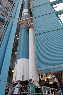 Aerospace Photography Prints: The second solid rocket motor is moved into place alongside the Delta II first stage