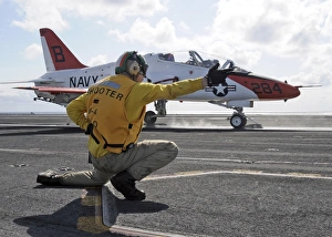 A shooter launches a T-45 Goshawk training aircraft A shooter launches a T-45 Goshawk training aircraft