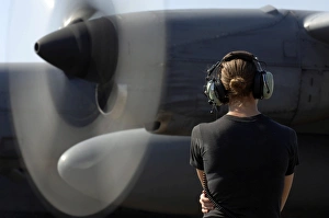 A soldier monitors the performance of a newly repaired C-130 Hercules engine A soldier monitors the performance of a newly repaired C-130 Hercules engine
