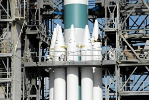 Solid rocket boosters are attached to the Delta II rocket in the mobile service tower Solid rocket boosters are attached to the Delta II rocket in the mobile service tower