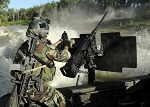 Images Dated 17th June 2007: A Special Warfare Combatant-craft Crewman reloading an M2 Heavy Barrel