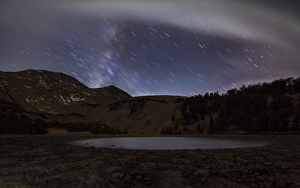 Star trails and the blurred band of the Milky Way above a lake in the Eastern Sierra Star trails and the blurred band of the Milky Way above a lake in the Eastern Sierra
