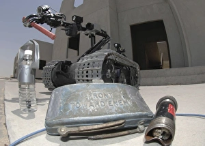 A Talon 3B robot recovering a stick of dynamite and other explosive devices in Bahrain A Talon 3B robot recovering a stick of dynamite and other explosive devices in Bahrain