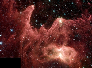 Towering pillars of cool gas and dust are illuminated at their tips with light from warm Towering pillars of cool gas and dust are illuminated at their tips with light from warm