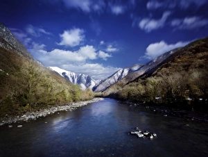Tranquil river in the mountains against cloudy sky, Ritsa Nature Reserve Tranquil river in the mountains against cloudy sky, Ritsa Nature Reserve