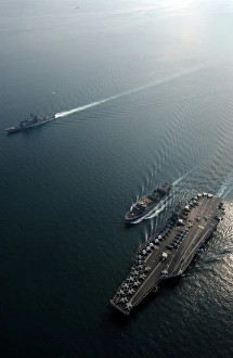 USNS Saturn conducts a vertical replenishment at sea with USS Harry S USNS Saturn conducts a vertical replenishment at sea with USS Harry S