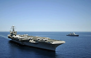 USS Harry S. Truman cruises alongside the German Navy frigate FGS Hessen USS Harry S. Truman cruises alongside the German Navy frigate FGS Hessen