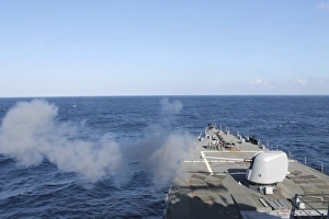USS Mahan fires a 5-inch gun during a training exercise USS Mahan fires a 5-inch gun during a training exercise