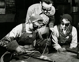 Women In Industry History Prints: Two women learning to weld with their instructor