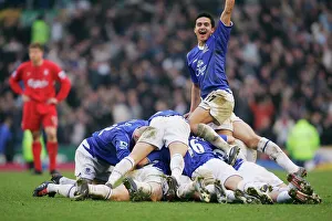 The Everton team pile on Lee Carsley after his goal The Everton team pile on Lee Carsley after his goal