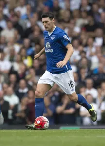 A black and white print of Gareth Barry in action during a football match