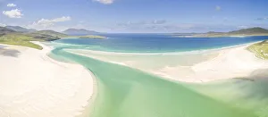 Aerial view of aquamarine water and Luskentyre white sand beach in summer, Isle of Harris, Outer Hebrides, Scotland, UK Aerial view of aquamarine water and Luskentyre white sand beach in summer, Isle of Harris, Outer Hebrides, Scotland, UK