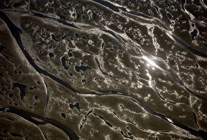 Aerial view of channels and pools left in sand at low tide, Hallig, Germany, April 2009 Aerial view of channels and pools left in sand at low tide, Hallig, Germany, April 2009
