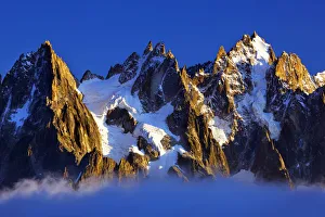 Aiguilles de Chamonix at sunset with clouds rising, Haute Savoie, France, Europe, September 2008 Aiguilles de Chamonix at sunset with clouds rising, Haute Savoie, France, Europe, September 2008