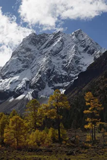 Autumn landscape in the U-shaped valley. Snow covered mountain landscape and vegetation Autumn landscape in the U-shaped valley. Snow covered mountain landscape and vegetation
