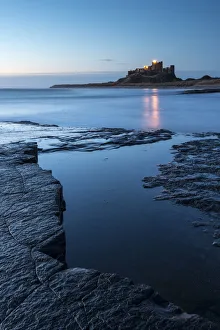 Bamburgh Castle, early morning light at dawn, Bamburgh, Northumberland, UK, April 2013 Bamburgh Castle, early morning light at dawn, Bamburgh, Northumberland, UK, April 2013