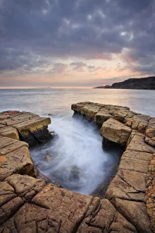 Broad Bench at sunset, rocks exposed at low tide, Kimmeridge Bay, Jurassic Coast Broad Bench at sunset, rocks exposed at low tide, Kimmeridge Bay, Jurassic Coast