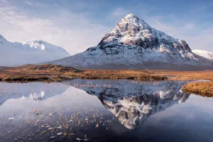 Buachaille Etive Beag reflected in Lochan na Fola after snowfall, early morning light Buachaille Etive Beag reflected in Lochan na Fola after snowfall, early morning light