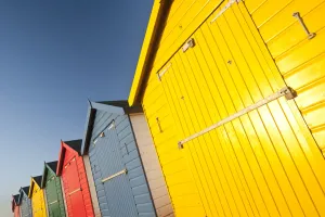 Colourful beach huts in early morning light. Dawlish Warren, South Devon, UK, February Colourful beach huts in early morning light. Dawlish Warren, South Devon, UK, February