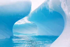 Curves on edge of iceberg in Southern Ocean. One of the most rapidly warming areas on the Curves on edge of iceberg in Southern Ocean. One of the most rapidly warming areas on the