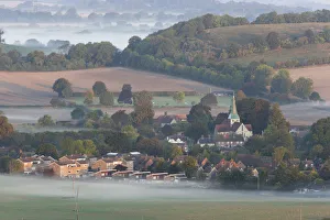 Dawn mist on the fields around the village of South Harting. South Downs, Sussex Dawn mist on the fields around the village of South Harting. South Downs, Sussex