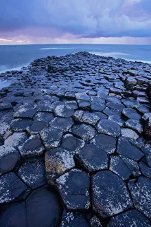 Giants Causeway, columnar basalt columns, result of an ancient volcanic fissure Giants Causeway, columnar basalt columns, result of an ancient volcanic fissure