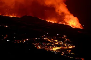 Lava flow and ash from erupting volcano passing close by the village of Los Llanos de Aridane, Volcano Cumbre en Vieja Lava flow and ash from erupting volcano passing close by the village of Los Llanos de Aridane, Volcano Cumbre en Vieja