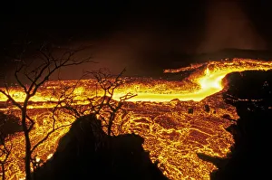 Lava flow in Fernandina Island, Galapagos Islands. Lava flowing at speed of water runs Lava flow in Fernandina Island, Galapagos Islands. Lava flowing at speed of water runs