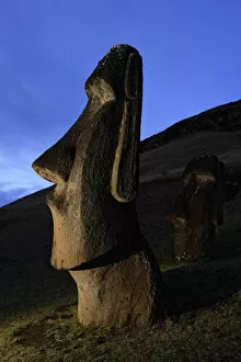 Images Dated 3rd November 2004: Moai stone statue at dusk on the slopes of the quarry at Rano Raraku volcano, Easter