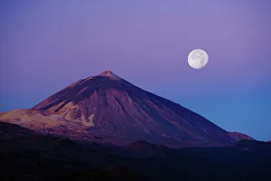 Full moon over Teide volcano (3, 718m) at sunrise, Teide National Park, Tenerife, Canary Islands Full moon over Teide volcano (3, 718m) at sunrise, Teide National Park, Tenerife, Canary Islands