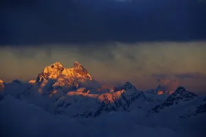 Mount Ushba (4, 710m) just on the Georgian side of the border, just before sunset Mount Ushba (4, 710m) just on the Georgian side of the border, just before sunset