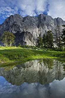 Mount Velika Mojstrovka (2, 056m) reflected in a pool, viewed from Sleme, Triglav National Park Mount Velika Mojstrovka (2, 056m) reflected in a pool, viewed from Sleme, Triglav National Park