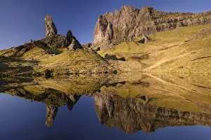 Old Man of Storr reflected in small lochan in morning light Old Man of Storr reflected in small lochan in morning light
