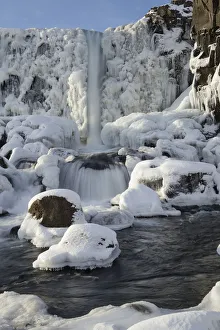 Oxararfoss waterfall in winter, Almannagja Fissure, Thingvellir southern Iceland Oxararfoss waterfall in winter, Almannagja Fissure, Thingvellir southern Iceland