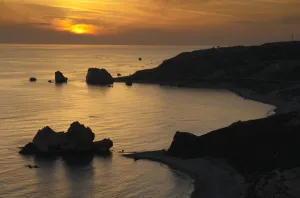Petra tou Romiou (Aphrodites Rock) silhouetted at sunset, Pissouri Bay, near Paphos Petra tou Romiou (Aphrodites Rock) silhouetted at sunset, Pissouri Bay, near Paphos