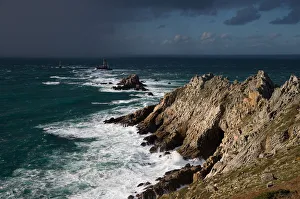 Rain shower approaching La Vieille lighthouse, Pointe du Raz, Brittany, France Rain shower approaching La Vieille lighthouse, Pointe du Raz, Brittany, France