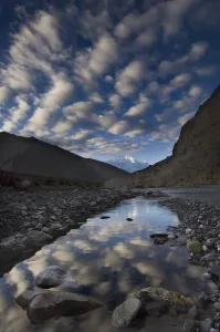 Reflection of clouds in water next to the Kali Ghandaki river, Nilgiri range, Chhusang Reflection of clouds in water next to the Kali Ghandaki river, Nilgiri range, Chhusang