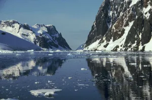 Reflections in Lemaire Channel with brash ice, Antarctica Reflections in Lemaire Channel with brash ice, Antarctica