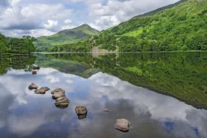 Reflections in Llyn Gwynant in the Glaslyn valley, looking west with Yr Aran mountain in Reflections in Llyn Gwynant in the Glaslyn valley, looking west with Yr Aran mountain in