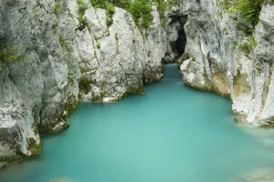 River Lepenjica flowing through narrow gap in rocks, Triglav National Park, Slovenia River Lepenjica flowing through narrow gap in rocks, Triglav National Park, Slovenia