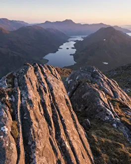 Rock formations on Bhudhie Bheinn lit by the setting sun. Knoydart, Scotland, UK Rock formations on Bhudhie Bheinn lit by the setting sun. Knoydart, Scotland, UK